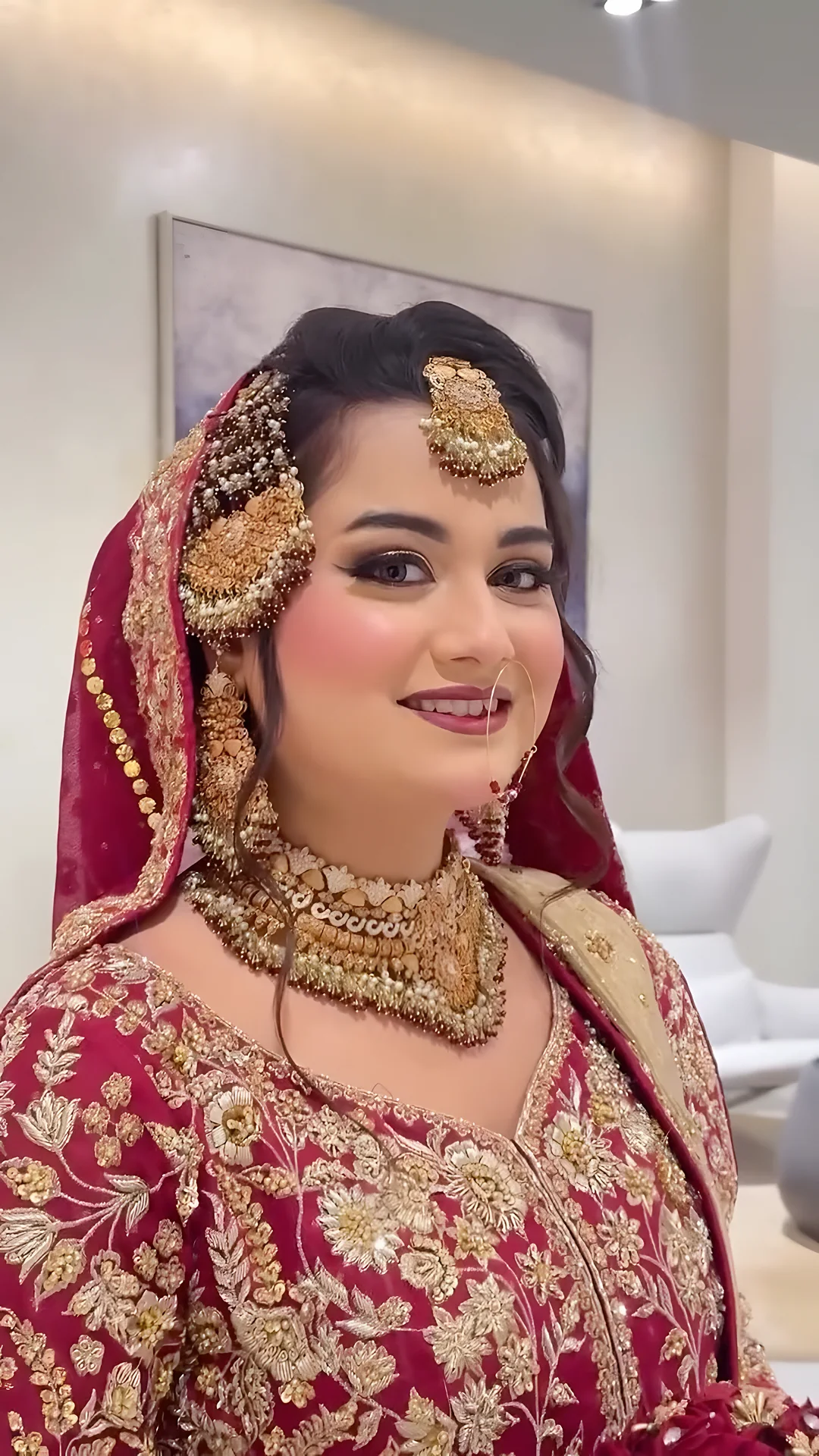 Bride in red with a gold dupatta